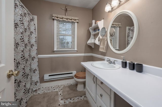 bathroom featuring toilet, vanity, tile patterned floors, and a baseboard heating unit