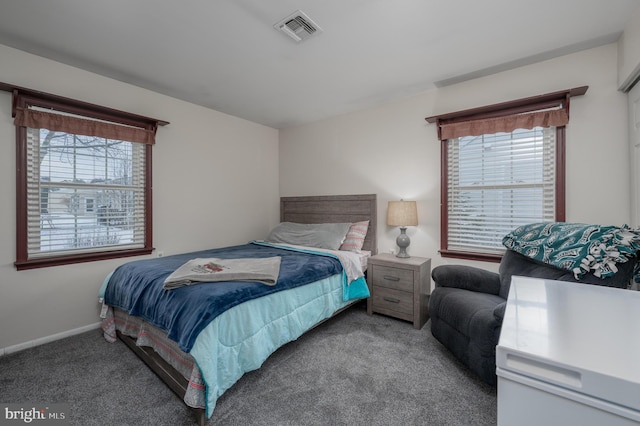 bedroom featuring light carpet