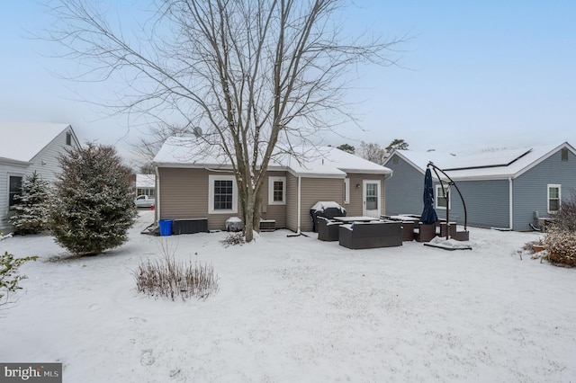 snow covered property featuring an outdoor living space