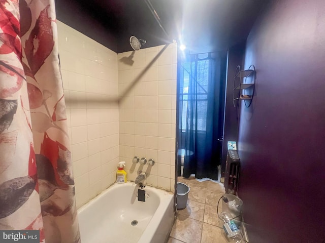 bathroom featuring tile patterned flooring and shower / bath combination with curtain