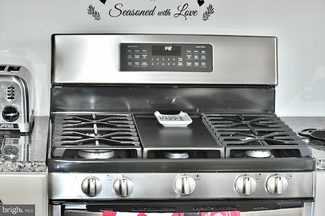 interior details with stainless steel range with gas stovetop