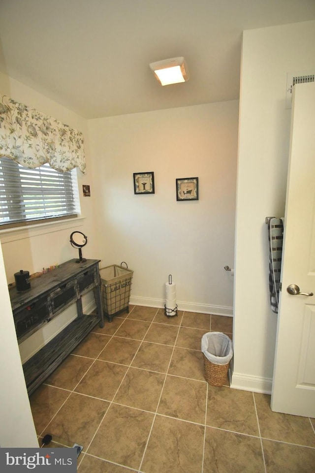 bathroom with tile patterned flooring