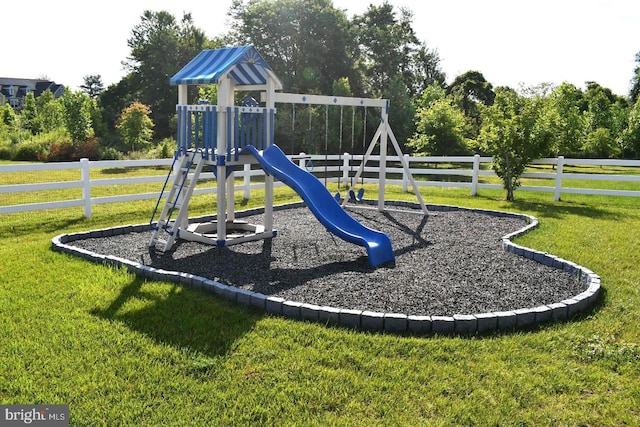 view of play area featuring a lawn