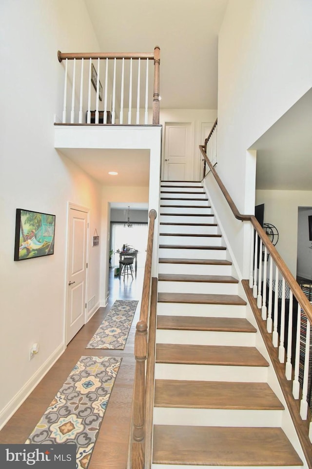 stairway featuring hardwood / wood-style floors