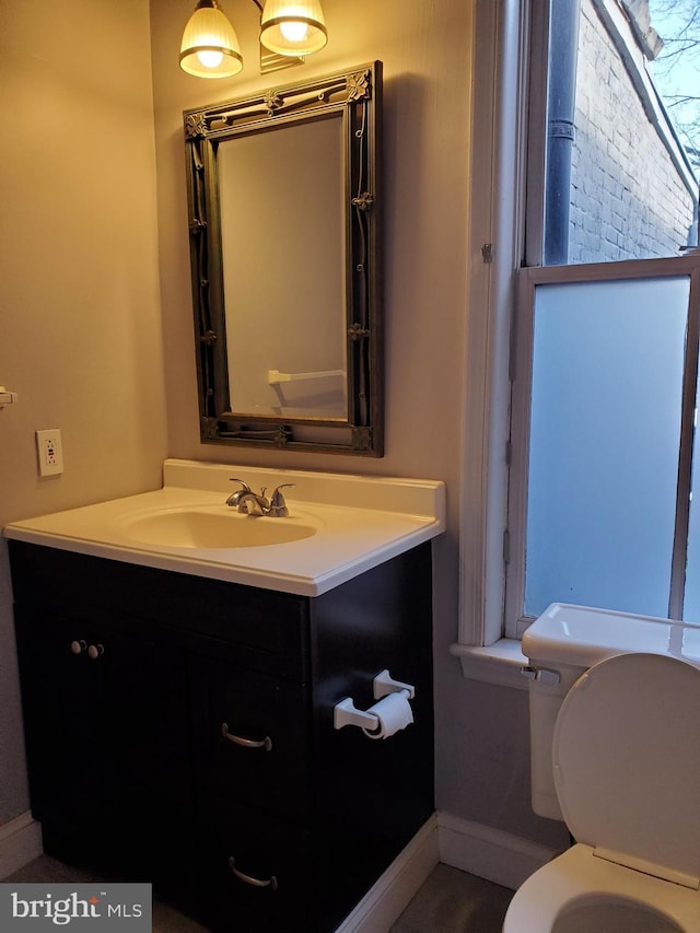 bathroom featuring vanity and toilet