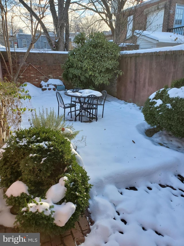 view of yard layered in snow