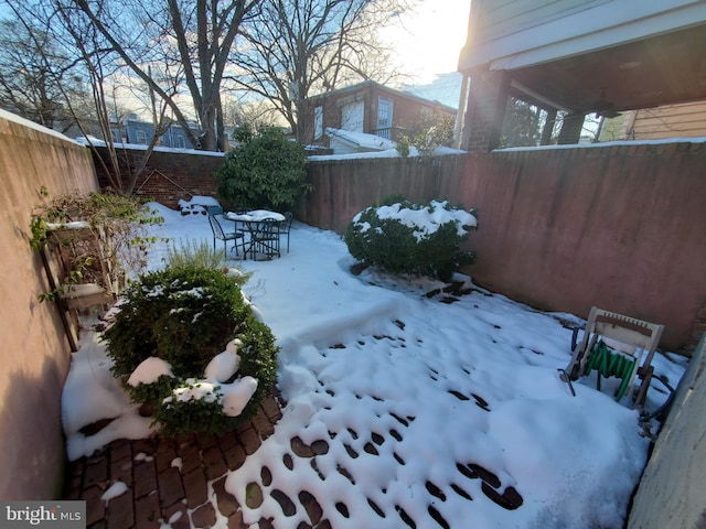 view of yard covered in snow