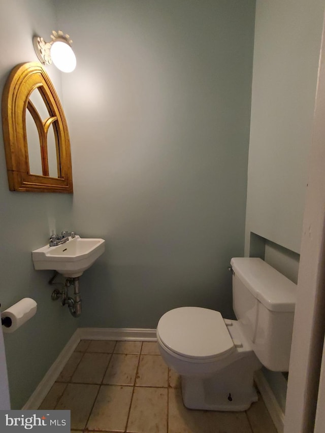 bathroom featuring tile patterned flooring and toilet