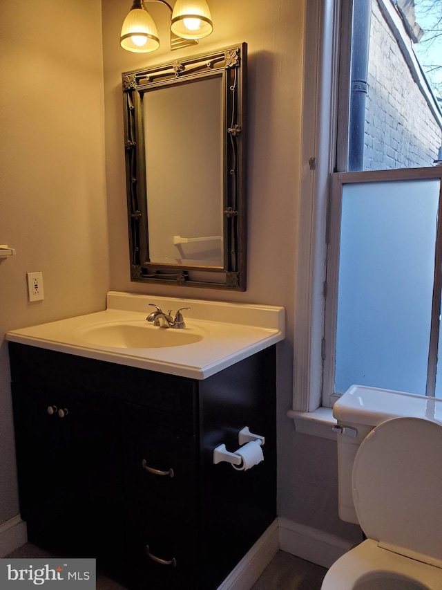 bathroom with vanity and toilet