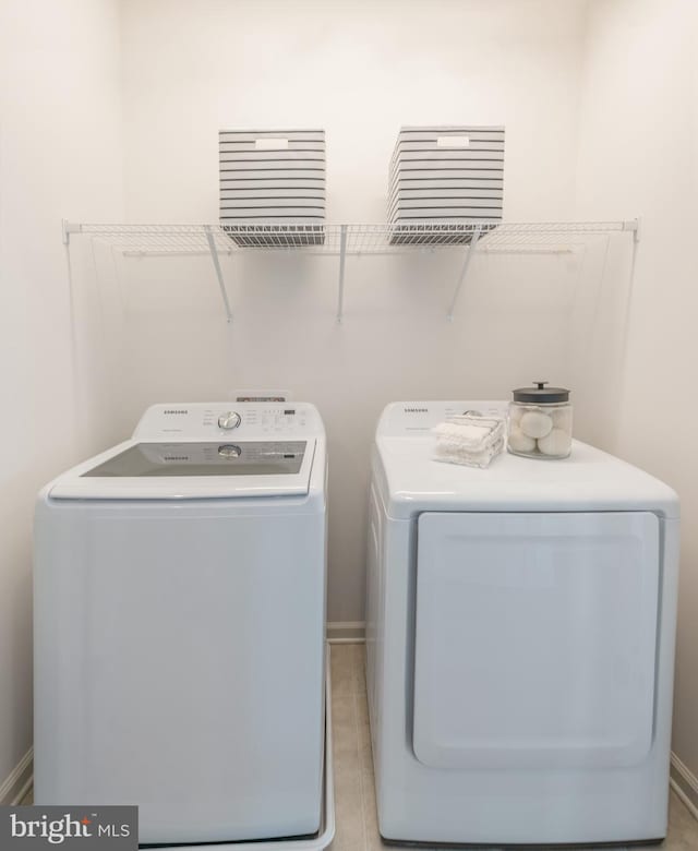 clothes washing area featuring washer and dryer