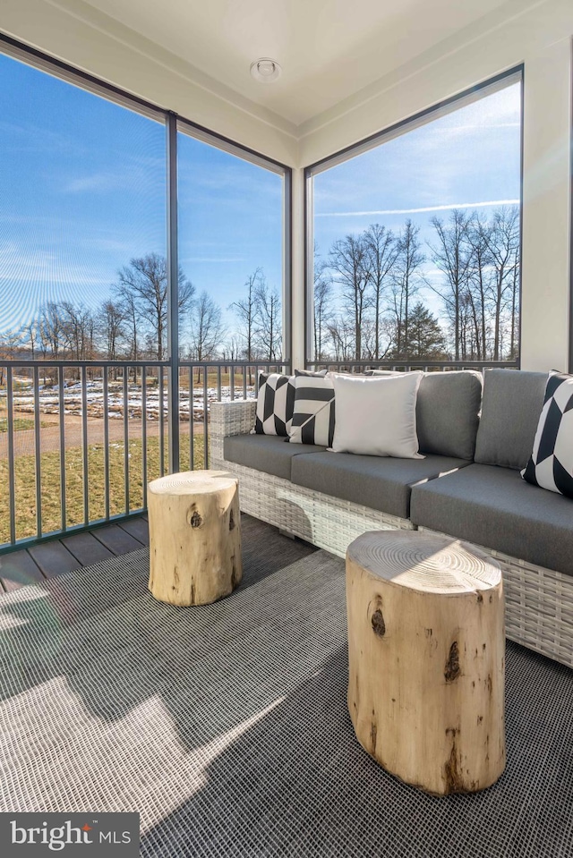 sunroom / solarium featuring a healthy amount of sunlight