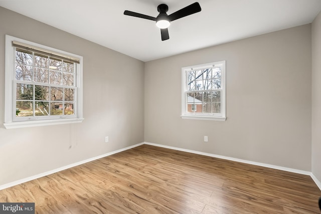 spare room featuring ceiling fan and wood-type flooring