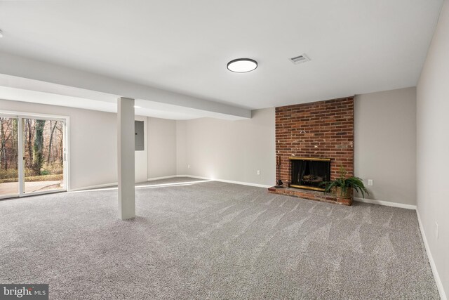 basement featuring carpet floors, a fireplace, and electric panel