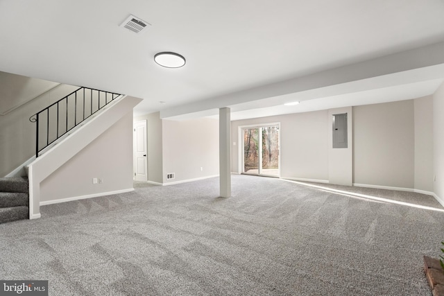 basement with carpet floors and electric panel