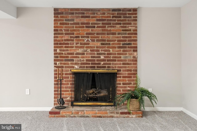 details featuring carpet floors and a brick fireplace