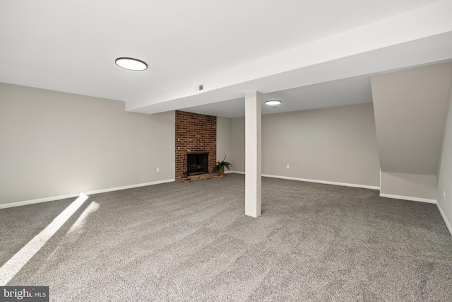 basement with carpet flooring and a fireplace