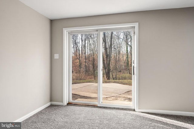 entryway with carpet flooring