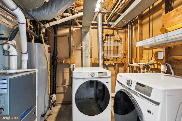 laundry room featuring separate washer and dryer and water heater