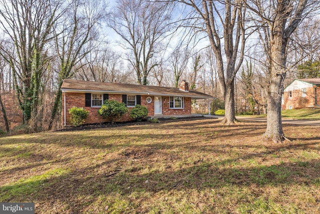 ranch-style house with a front yard