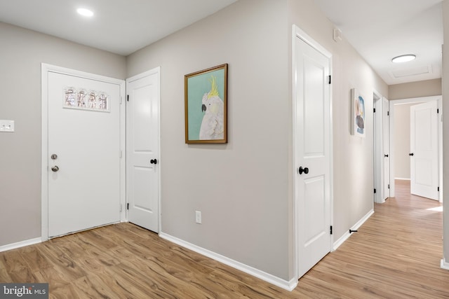 foyer with light hardwood / wood-style floors