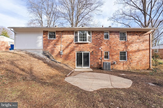 rear view of property featuring a patio and central AC unit