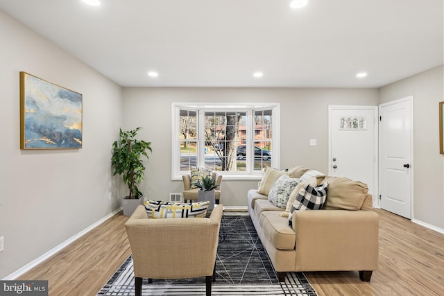 living room with light hardwood / wood-style flooring