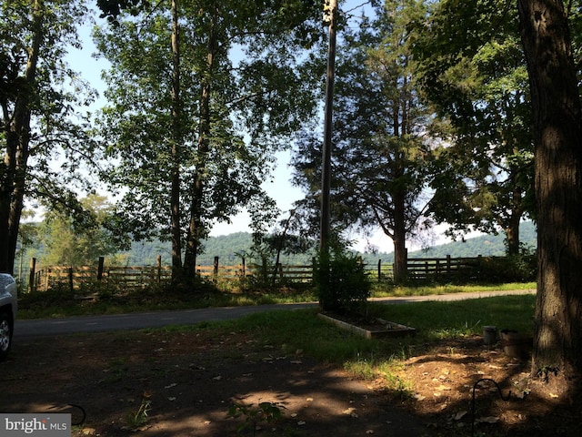 view of yard with a rural view