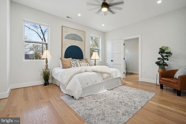 bedroom featuring light hardwood / wood-style flooring and ceiling fan