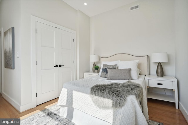 bedroom featuring light hardwood / wood-style floors and a closet