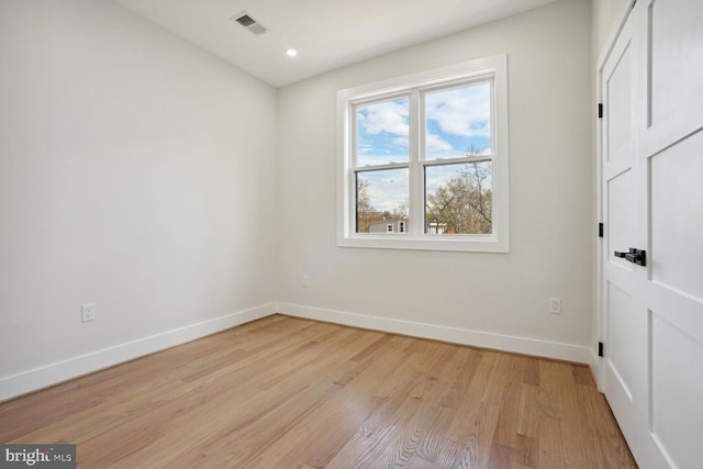 unfurnished room with light hardwood / wood-style flooring