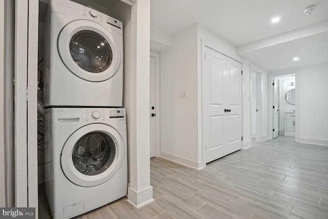 washroom with stacked washer / dryer