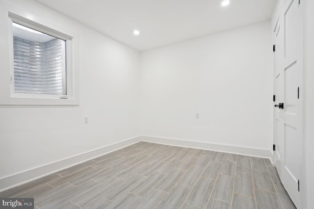 empty room with light hardwood / wood-style flooring