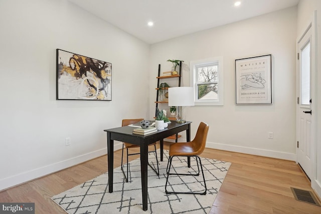 office with light hardwood / wood-style floors