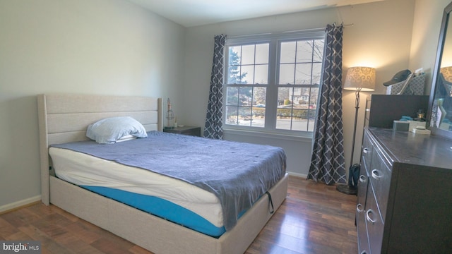 bedroom featuring dark wood-type flooring