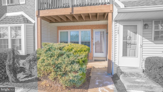 entrance to property with a balcony