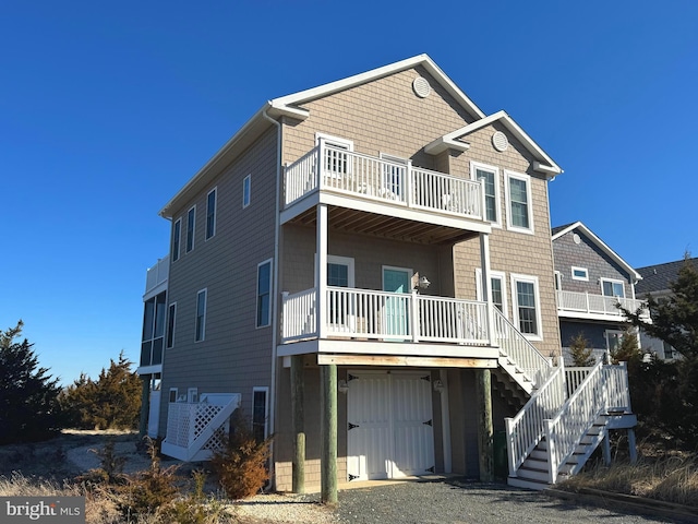 rear view of house with a garage