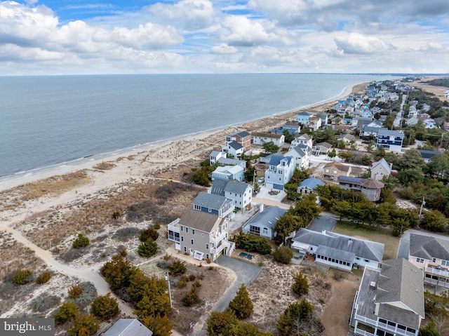 aerial view featuring a water view and a view of the beach