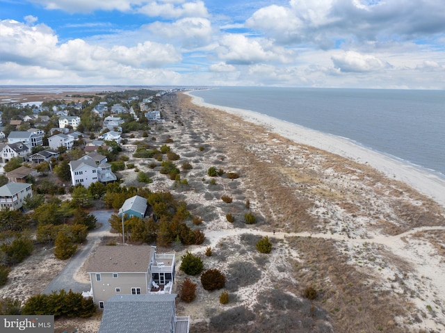 aerial view featuring a view of the beach and a water view