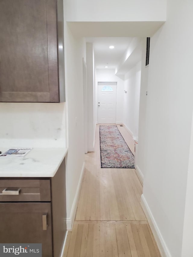 hallway featuring light hardwood / wood-style flooring