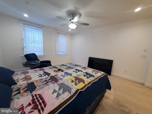 bedroom featuring light wood-type flooring and ceiling fan