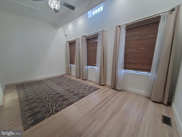 spare room featuring light hardwood / wood-style floors and ceiling fan