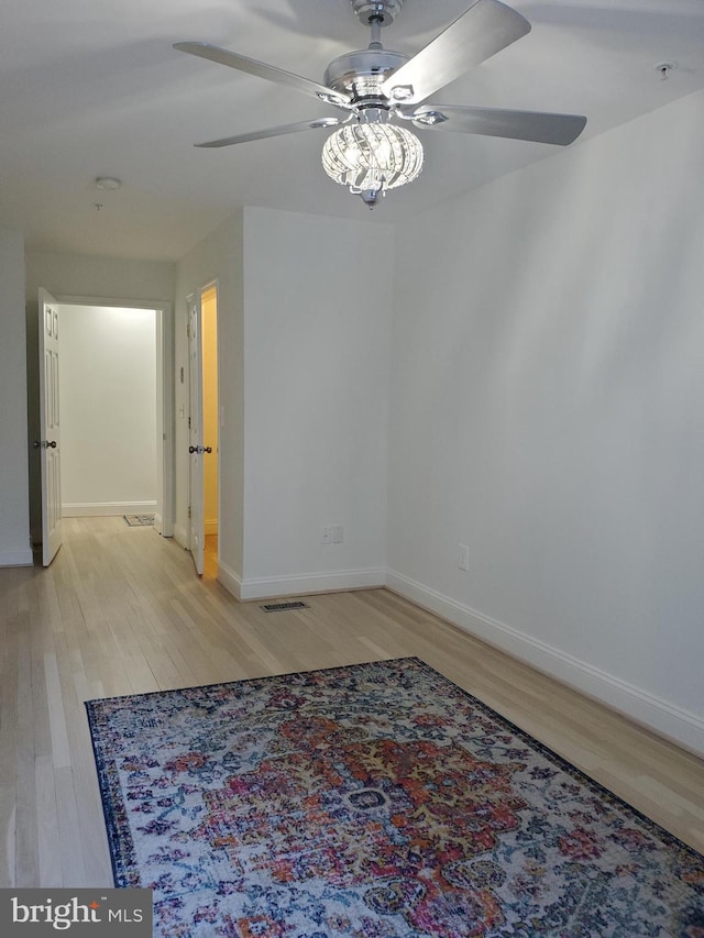 interior space with light wood-type flooring and ceiling fan