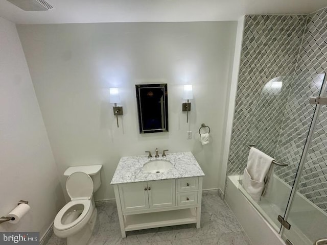 full bathroom with toilet, enclosed tub / shower combo, and vanity