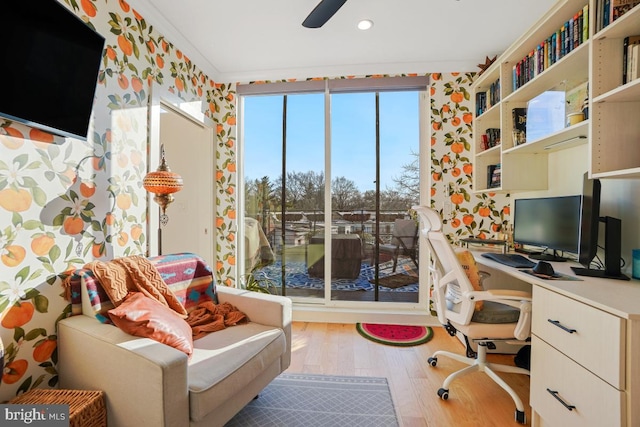 home office with ceiling fan, light hardwood / wood-style floors, and crown molding