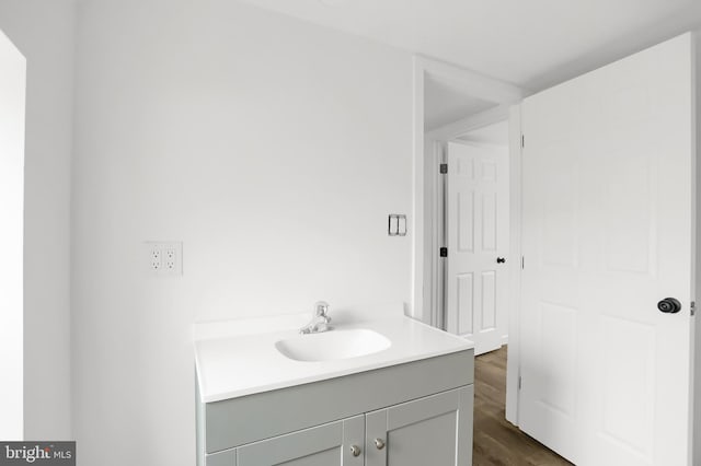 bathroom featuring hardwood / wood-style flooring and vanity