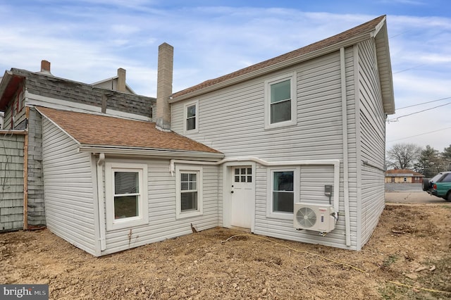 back of property featuring ac unit