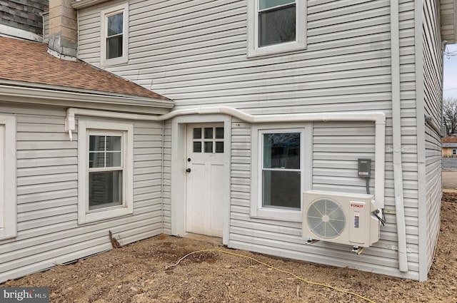 view of exterior entry featuring ac unit