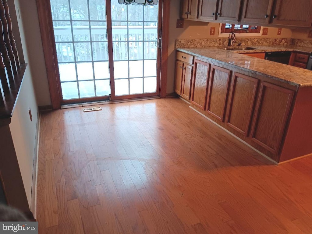 kitchen featuring sink and light wood-type flooring