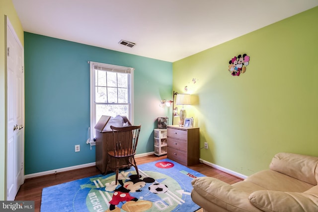 sitting room featuring hardwood / wood-style flooring