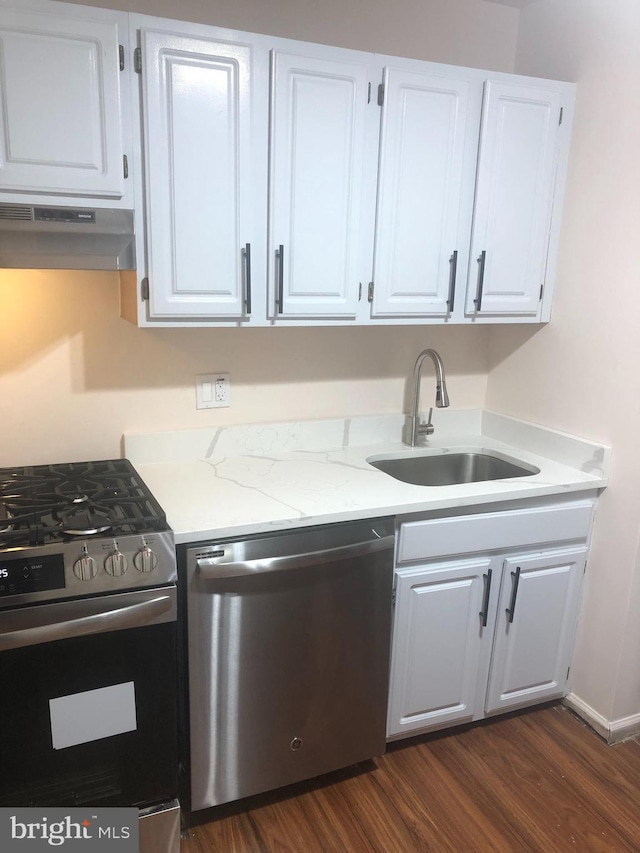 kitchen with sink, white cabinets, and appliances with stainless steel finishes